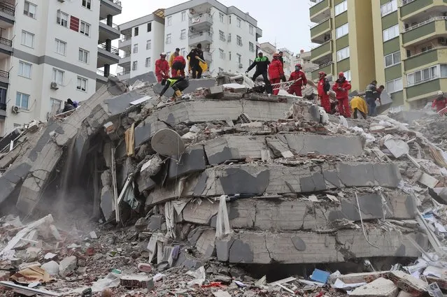 Personnel conduct search and rescue operations in Adana, Turkiye after 7.7 and 7.6 magnitude earthquakes hits Turkiye's Kahramanmaras, on February 06, 2023. Disaster and Emergency Management Authority (AFAD) of Turkiye said the 7.7 magnitude quake struck at 4.17 a.m. (0117GMT) and was centered in the Pazarcik district and 7.6 magnitude quake struck in Elbistan district in the province of Kahramanmaras in the south of Turkiye. Gaziantep, Sanliurfa, Diyarbakir, Adana, Adiyaman, Malatya, Osmaniye, Hatay, and Kilis provinces are heavily affected by the earthquakes. (Photo by Oguz Yeter/Anadolu Agency via Getty Images)