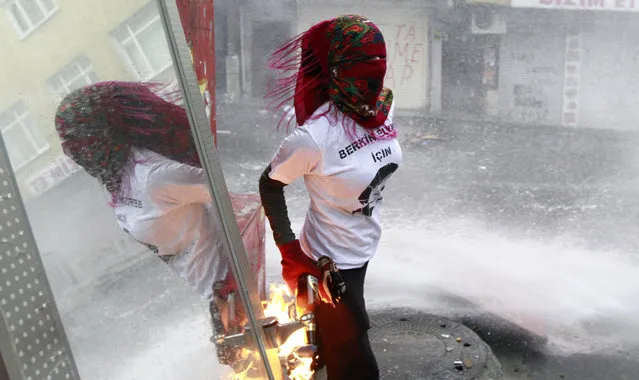 Protestors clash with police during a rally marking the first anniversary of Berkin Elvan's death in Istanbul, Turkey, 11 March 2015. Berkin Elvan, 15 years old, died on 11 March 2014 after 296 days in a coma in consequence to the injuries suffered when he was hit by a gas canister during the police crackdown on protesters at Gezi Park in June 2013. (Photo by Ulas Yunus Tosun/EPA)
