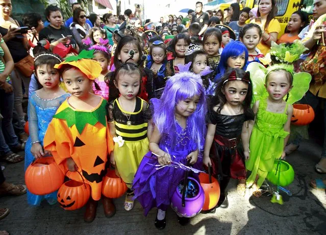 Students of Brainshire Science School wear costumes as they participate in a halloween parade in Paranaque city, metro Manila October 30, 2015. (Photo by Romeo Ranoco/Reuters)