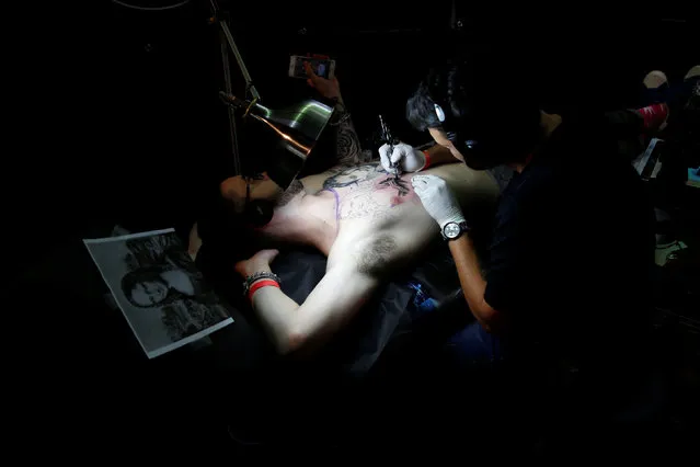 A man is tattooed during the annual Israel Tattoo Convention in Tel Aviv, Israel, October 8, 2016. (Photo by Baz Ratner/Reuters)