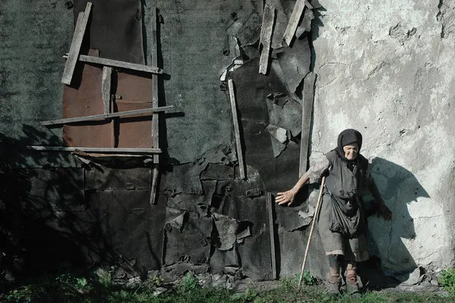 “His house”. Deaf-blind resident of the village Bolshedmitrovka, Russia, near his home. (Photo by Andrej Arhipov)