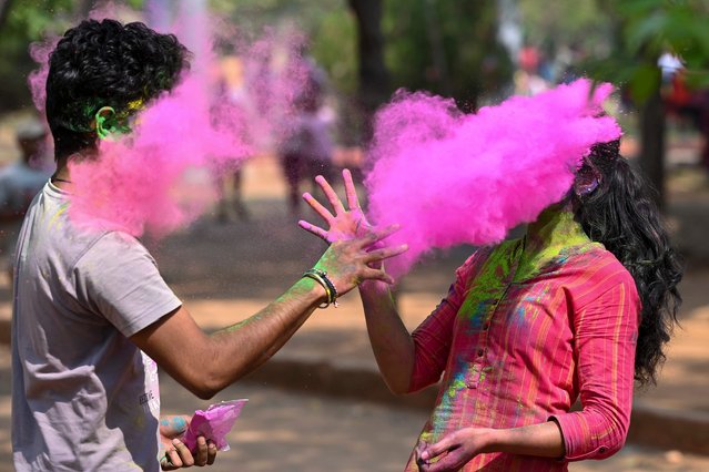 People smeared with “Gulal” or coloured powder during celebrations of Hindu spring festival “Holi” in Hyderabad, India on March 7, 2023. (Photo by Noah Seelam/AFP Phoot)