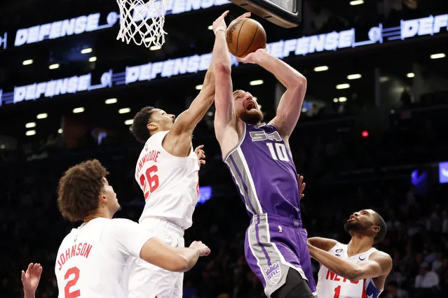 Domantas Sabonis #10 of the Sacramento Kings goes to the basket as Spencer Dinwiddie #26 of the Brooklyn Nets defends during the second half at Barclays Center on March 16, 2023 in New York City. The Kings won 101-96. (Photo by Sarah Stier/Getty Images)