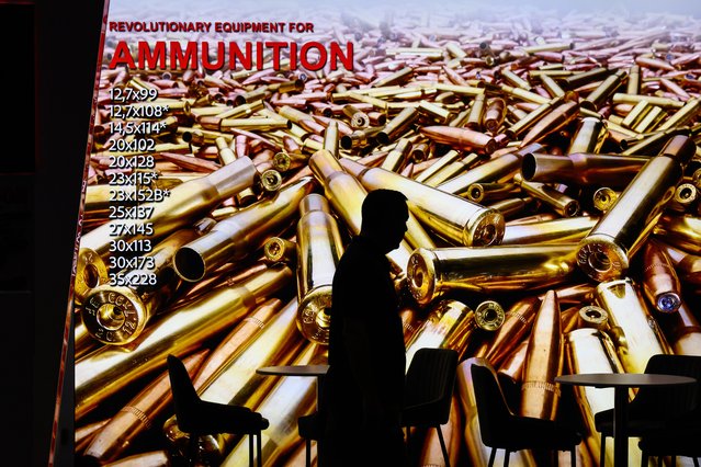 A visitor walks past a display for the Italian ammunition manufacturer Invernizzi Presse on day one of the Defence and Security Equipment International (DSEI) on September 09, 2025 in London, England. The DSEI hosts defence equipment manufacturers from around the world at a 4-day exhibition in London. (Photo by Leon Neal/Getty Images)