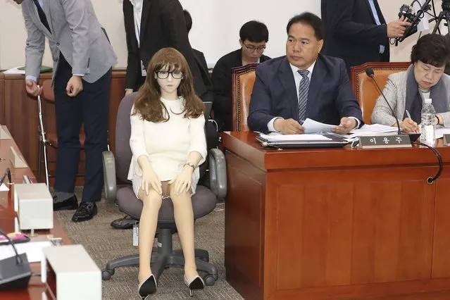 A lawmaker Lee Yong-ju, who brought a s*x doll, speaks during a parliamentary inspection at the National Assembly in Seoul, South Korea, on October 18, 2019. South Korea has formally ended a ban on the import of full-body s*x dolls, ending years of debate over how much the government can interfere in private life. Although there are no laws or regulations banning the import of s*x dolls, hundreds and perhaps thousands have been seized by the customs, which cited a clause in the law that bans the import of goods that “harm the country’s beautiful traditions and public moral”. (Photo by Lee Jong-chul/Newsis via AP Photo)