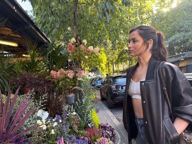 Cuban-American actress Ana de Armas browses bouquets in Paris on October 5, 2025. (Photo by ana_d_armas/Instagram)