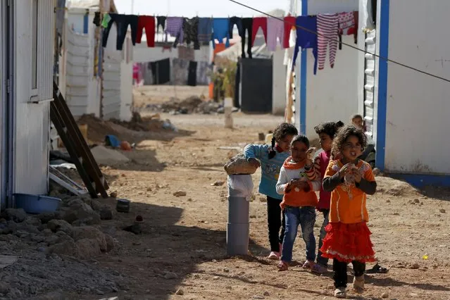 Syrian refugee children play near their families residence at Al Zaatari refugee camp, in the Jordanian city of Mafraq, near the border with Syria, November 29, 2015. (Photo by Muhammad Hamed/Reuters)
