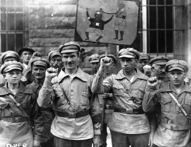 Members of the far-left Antifa extremist organization give a clenched fist salute on Sept. 1, 1928. The group's original intent was to bring out a communist dictatorship in Germany. (Photo by Fox Photos/Getty Images)