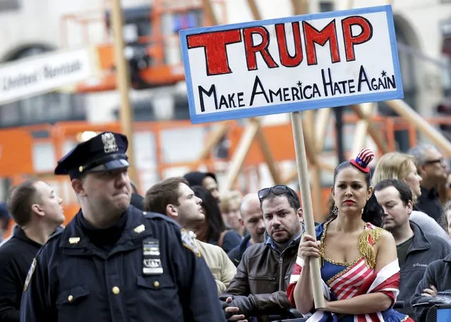 People take part in an anti-Donald Trump, pro-immigration protest outside the Plaza Hotel, where U.S. Republican presidential candidate Donald Trump spoke, in the Manhattan borough of New York  December 11, 2015. (Photo by Brendan McDermid/Reuters)