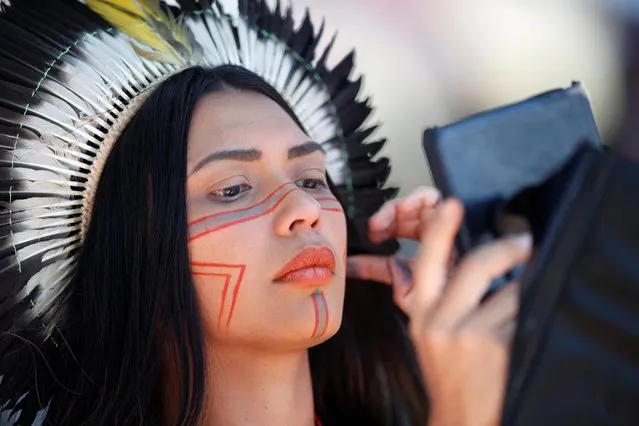Janaina Jenipapo from the Jenipapo-Kaninde tribe looks on during the Terra Livre (Free Land) camp, a protest-camp to defend indigenous land and cultural rights that they say are threatened by the right-wing government of Brazil's President Jair Bolsonaro, in Brasilia, Brazil on April 5, 2022. (Photo by Adriano Machado/Reuters)