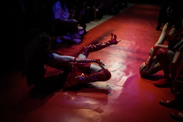 People perform on stage at a voguing “ball” in Shanghai, China on May 13, 2023. (Photo by Aly Song/Reuters)