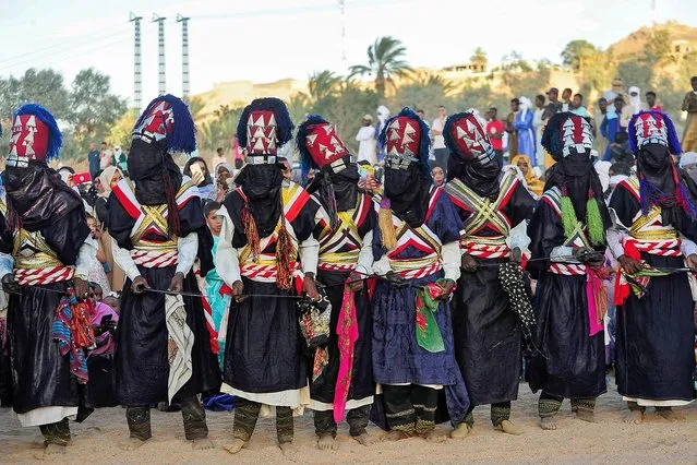 Performers showcase a traditional dance during the Sebeiba Festival, a yearly celebration of Tuareg culture, in the oasis town of Djanet in southeastern Algeria on July 29, 2023. (Photo by AFP Photo/Stringer)