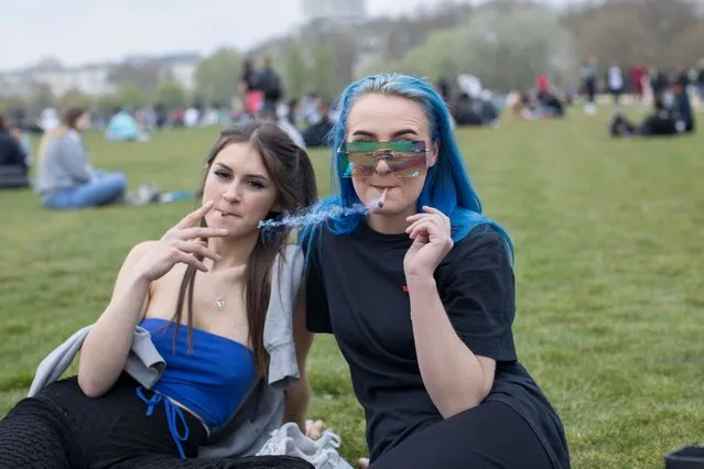 Two women were enjoying a spliff as hundreds gathered in Hyde Park to mark the informal cannabis holiday, 4/20, London, United Kingdom, April 20, 2021. (Photo by Rick Findler/London News Pictures)