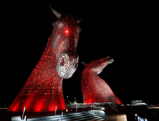 The Kelpies, two 30-meter-high stainless-plate horse-head sculptures by Andy Scott are lit in red to mark world aids day in Falkirk, Scotland December 1, 2016. (Photo by Russell Cheyne/Reuters)