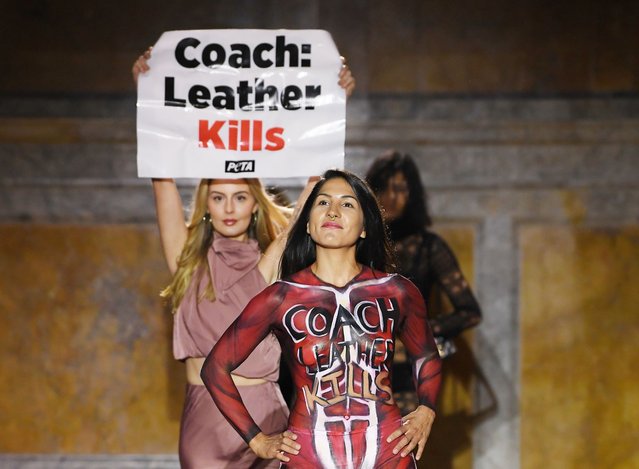 Protesters walk the runway at the COACH Spring 2024 Ready To Wear Fashion Show and dinner event at the New York Public Library (NYPL) on September 7, 2023 in New York, New York. (Photo by Giovanni Giannoni/WWD via Getty Images)
