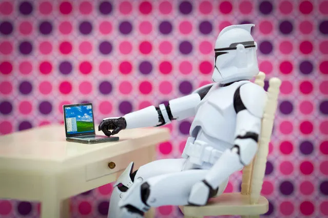 A storm trooper sits on its laptop, taken in Glasgow, Scotland, December 2016. (Photo by David Gilliver/Barcroft Images)