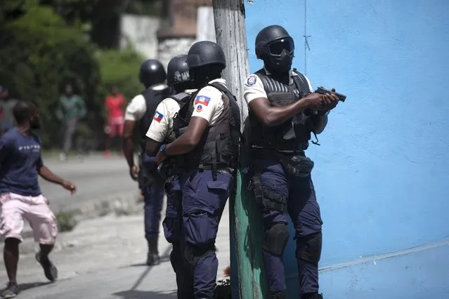 Police officers patrol in search for suspects in the murder Haiti's President Jovenel Moise, in Port-au-Prince, Haiti, Thursday, July 8, 2021. Moise was assassinated in an attack on his private residence early Wednesday. (Photo by Joseph Odelyn/AP Photo)