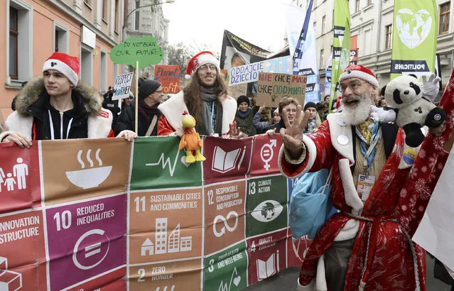 Climate activists attend the March for Climate in a protest against global warming in Katowice, Poland, Saturday, December 8, 2018, as the COP24 UN Climate Change Conference takes place in the city. (Photo by Alik Keplicz/AP Photo)