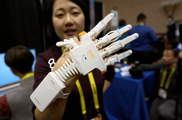 Anna Choi of Neofect demonstrates the Rapael Smart Glove therapy device for stroke victims at CES in Las Vegas, January 3, 2017. (Photo by Rick Wilking/Reuters)