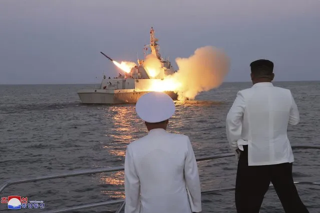 In this undated photo provided on Monday, August 21, 2023, by the North Korean government, North Korean leader Kim Jong Un, right, observes what it says the test-firing of strategic cruise missiles. Independent journalists were not given access to cover the event depicted in this image distributed by the North Korean government. The content of this image is as provided and cannot be independently verified. Korean language watermark on image as provided by source reads: “KCNA” which is the abbreviation for Korean Central News Agency. (Photo by Korean Central News Agency/Korea News Service via AP Photo)