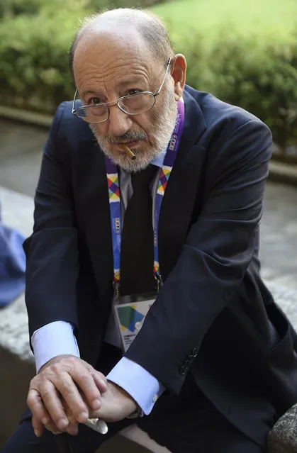 In this August 1, 2015 file photo, Italian writer Umberto Eco waits to visit Italian artist Leonardo Da Vinci's painting “The last Supper”, Milan, Italy.  Eco, best known for the international best-seller “The Name of the Rose”, died Friday, February 19, 2016. He was 84. (Photo by Daniel Dal Zennaro/ANSA via AP Photo)