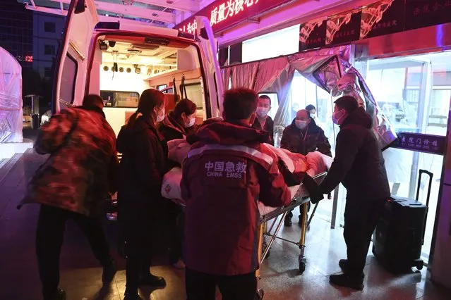 In this photo released by Xinhua News Agency, a person injured in an earthquake is transferred to a hospital in Jishishan Bao'an, Dongxiang, Sala Autonomous County of Linxia Hui Autonomous Prefecture, northwest China's Gansu Province, Tuesday, December 19, 2023. At least 100 people were killed in a magnitude 6.2 earthquake in a cold and mountainous region in northwestern China, the country's state media reported on Tuesday. (Photo by Fan Peishen/Xinhua via AP Photo)