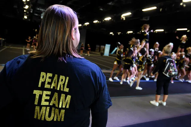 A family member watches a practice session during the Legacy Super Regional Cheer and Dance Championships at Copperbox Arena, Queen Elizabeth Olympic Park in London, Britain February 19, 2017. (Photo by Toby Melville/Reuters)