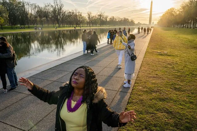 Worshipers listen to a sermon by Mark Batterson, lead pastor of National Community Church, during a sunrise Easter service at the Lincoln Memorial in Washington, Sunday, March 31, 2024. (Photo by Nathan Howard/AP Photo)