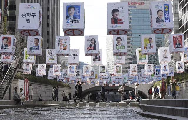 Election posters of 376 candidates for Seoul's constituencies in the April 13 general elections are hung on string over the Cheonggye Stream in Seoul, South Korea, Monday, April 4, 2016. The display made by the city's election management committee is aimed at encouraging people to vote in the elections. (Photo by Ahn Young-joon/AP Photo)