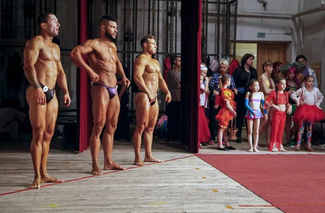 Participants pose during a regional bodybuilding championship in Stavropol, southern Russia, April 10, 2016. (Photo by Eduard Korniyenko/Reuters)