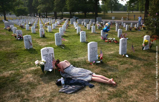 Mary McHugh mourns her slain fiance Sgt. James Regan at Section 60 of the Arlington National Cemetery
