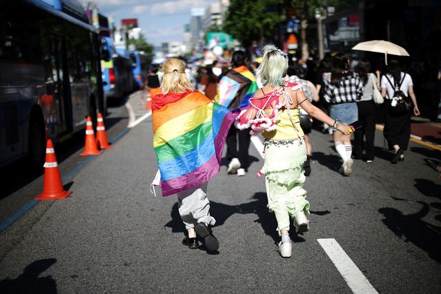 Participants run during the Seoul Queer Culture Festival in Seoul, South Korea, on June 1, 2024. (Photo by Kim Hong-Ji/Reuters)