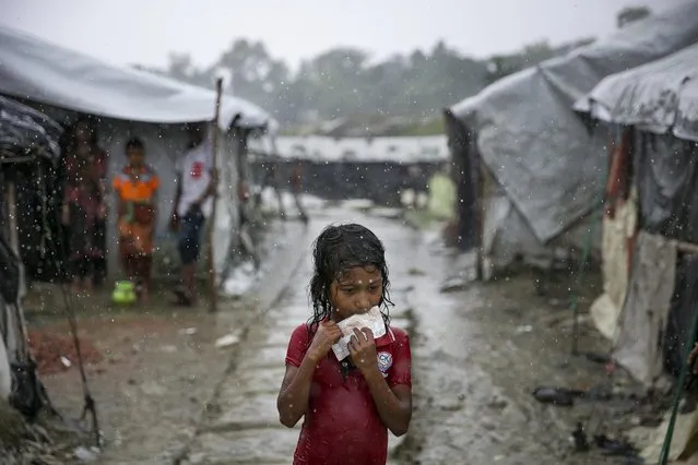 A young Rohingya is seen during a rainstorm at the Nayapara refugee camp on August 21, 2019 in Cox's Bazar, Bangladesh. Rohingya refugees said on August 21st that they did not want to return to Myanmar without their rights and citizenship, with repatriation set to start on August 22nd. August 25th marks the second anniversary of the Rohingya crisis in Bangladesh after Myanmar's military crackdown on the ethnic Muslim minority forced over 700,000 to flee to Bangladesh from violence and torture. The United Nations has stated that it is a textbook example of ethnic cleansing. (Photo by Allison Joyce/Getty Images)