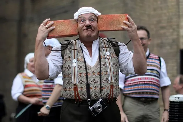 Monty Python fans dressed as the Gumbys gather in an attempt to set the world record for the largest gathering of people dressed as Gumbys as a part of the 50th anniversary of Monty Python's Flying Circus at the Roundhouse in London, Britain on October 5, 2019. (Photo by Simon Dawson/Reuters)