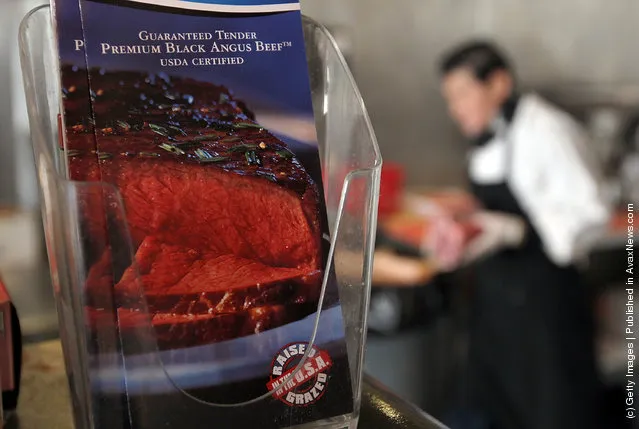 An advertisement for beef steaks is displayed at Marina Meats
