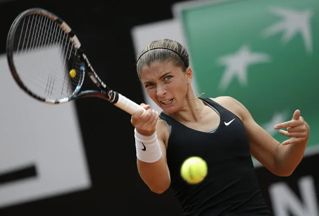 Sara Errani of Italy hits a return to Chanelle Scheepers of South Africa during their women's singles match at the Rome Masters tennis tournament May 13, 2014. (Photo by Max Rossi/Reuters)