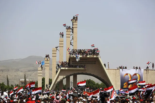 People attend a ceremony to commemorate the 26th anniversary of Yemen's reunification, in Sanaa, Yemen, Sunday, May 22, 2016. South and North Yemen were independent states until unification in 1990. (Photo by Hani Mohammed/AP Photo)