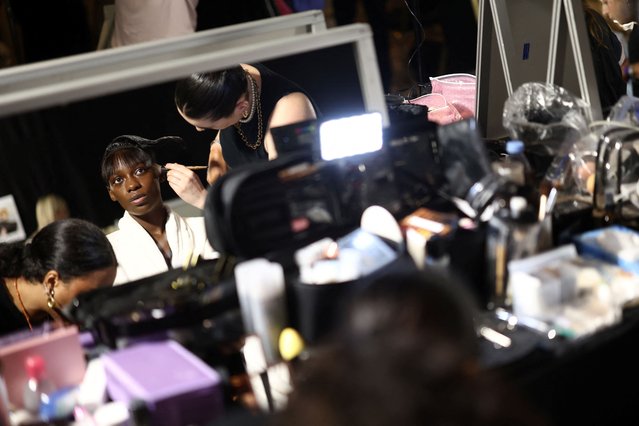 A model has her make-up applied backstage before the Viktor & Rolf Haute Couture Fall/Winter 2024-2025 collection show in Paris, France, on June 26, 2024. (Photo by Stephanie Lecocq/Reuters)