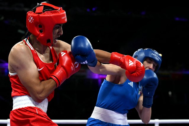 Algeria's Imane Khelif (in red) punches Italy's Angela Carini in the women's 66kg preliminaries round of 16 boxing match during the Paris 2024 Olympic Games at the North Paris Arena, in Villepinte on August 1, 2024. (Photo by Mohd Rasfan/AFP Photo)