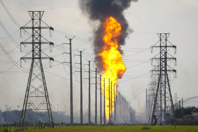 A pipeline with a giant plume of fire burns Monday, September 16, 2024, in La Porte, Texas. (Photo by Brett Coomer/Houston Chronicle via AP Photo)