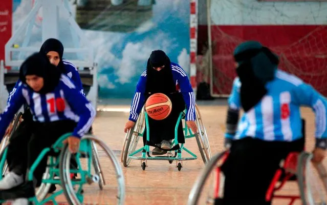 Disabled Yemeni women take part in a local wheelchair basketball championship in Yemen's capital Sanaa on December 9, 2019. (Photo by Mohammed Huwais/AFP Photo)