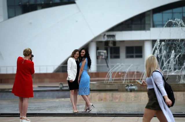 Women pose for a picture at the Millennium Square in Saransk, Russia on July 14, 2017. (Photo by David Mdzinarishvili/Reuters)