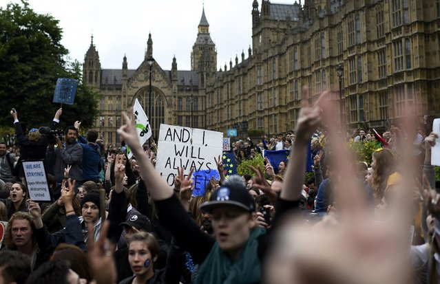 Demonstrators gesture outside the Houses of Parliament during a protest aimed at showing London's solidarity with the European Union following the recent EU referendum, in central London, Britain June 28, 2016. (Photo by Dylan Martinez/Reuters)