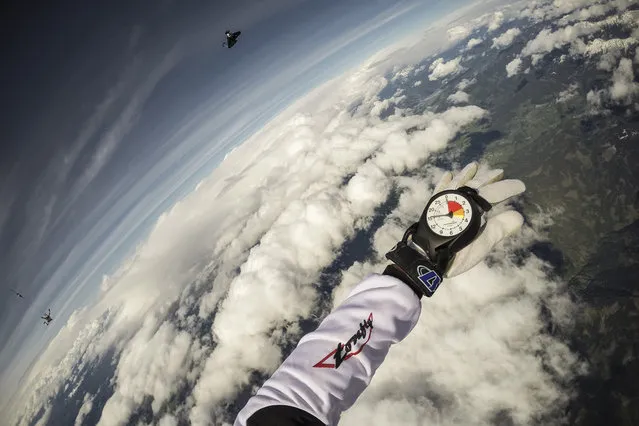 Fred Fugen seen training for a jump over Austria on May 12, 2014. Fearless skydivers jump from an altitude of 10,000 meters above the largest mountain in Europe. Frederic Fugen, 34, and Vincent Reffet, 29, leapt from a plane in the freezing skies above Mont-Blanc in the French Alps. The jump is from such a height the pictures show the curvature of the earth. (Photo by Dominique Daher/Barcroft Media)