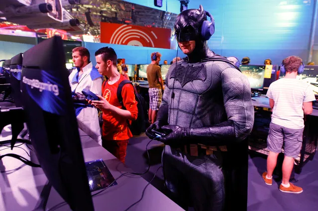 A cosplayer in a Batman costume plays the upcoming action shooter video game Battlefront II, based on the Star Wars film franchise at the world's largest computer games fair, Gamescom, in Cologne, Germany August 23, 2017. (Photo by Wolfgang Rattay/Reuters)
