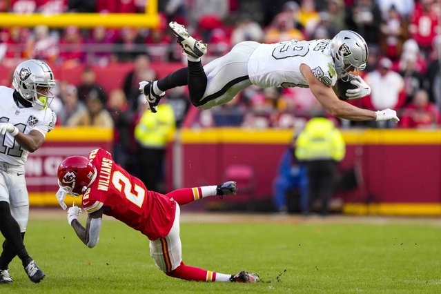 Las Vegas Raiders tight end Brock Bowers (89) tries to leap over Kansas City Chiefs cornerback Joshua Williams (2) during the first half of an NFL football game in Kansas City, Mo., Friday, November 29, 2024. (Photo by Ed Zurga/AP Photo)
