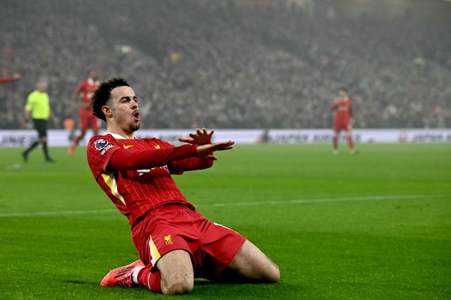 Liverpool's English midfielder #17 Curtis Jones celebrates scoring the team's second goal during the English Premier League football match between Liverpool and Leicester City at Anfield in Liverpool, north west England on December 26, 2024. (Photo by Paul Ellis/AFP Photo)