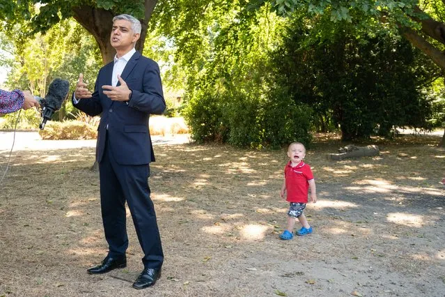 Maxwell Tall, 2, cries as Mayor of London Sadiq Khan speaks to the media during a visit to Mums for Lungs community group in South Woodford, London on Friday, July 29, 2022, to coincide with the final day of the ULEZ expansion consultation and the publishing of new air quality data. (Photo by Dominic Lipinski/PA Images via Getty Images)