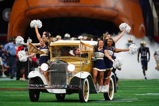 Georgia Tech Yellow Jackets cheerleaders roll out in the The Ramblin Wreck from Georgia Tech , the 1930 Ford Model A Sport coupe, before the game against the Clemson Tigers in the Chick-fil-A kickoff game at Mercedes-Benz Stadium in Atlanta, Georgia on September 5, 2022. (Photo by John David Mercer/USA TODAY Sports)
