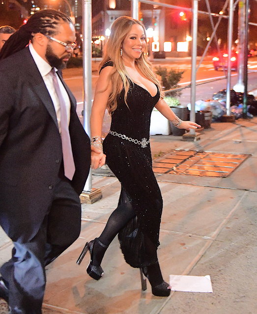 Mariah Carey looked better than ever on Monday night, October 23, 2017 as she stepped out in NYC. She performed at the V Magazine Party honoring Karl Lagerfeld, before heading to Blue Ribbon Sushi with her boyfriend Bryan Tanaka. Mariah displayed her stunning weight loss in a tight black dress, with a very low cut front. She seemed unfazed after being robbed of $50,000 worth of goods from her LA Home. When asked if the thief had been caught , Mariah scoffed and appeared uninterested in finding the crook at all. She said “I hope they like it” and casually strutted into her Tribeca Penthouse. (Photo by 247PAPS.TV/Splash News and Pictures)